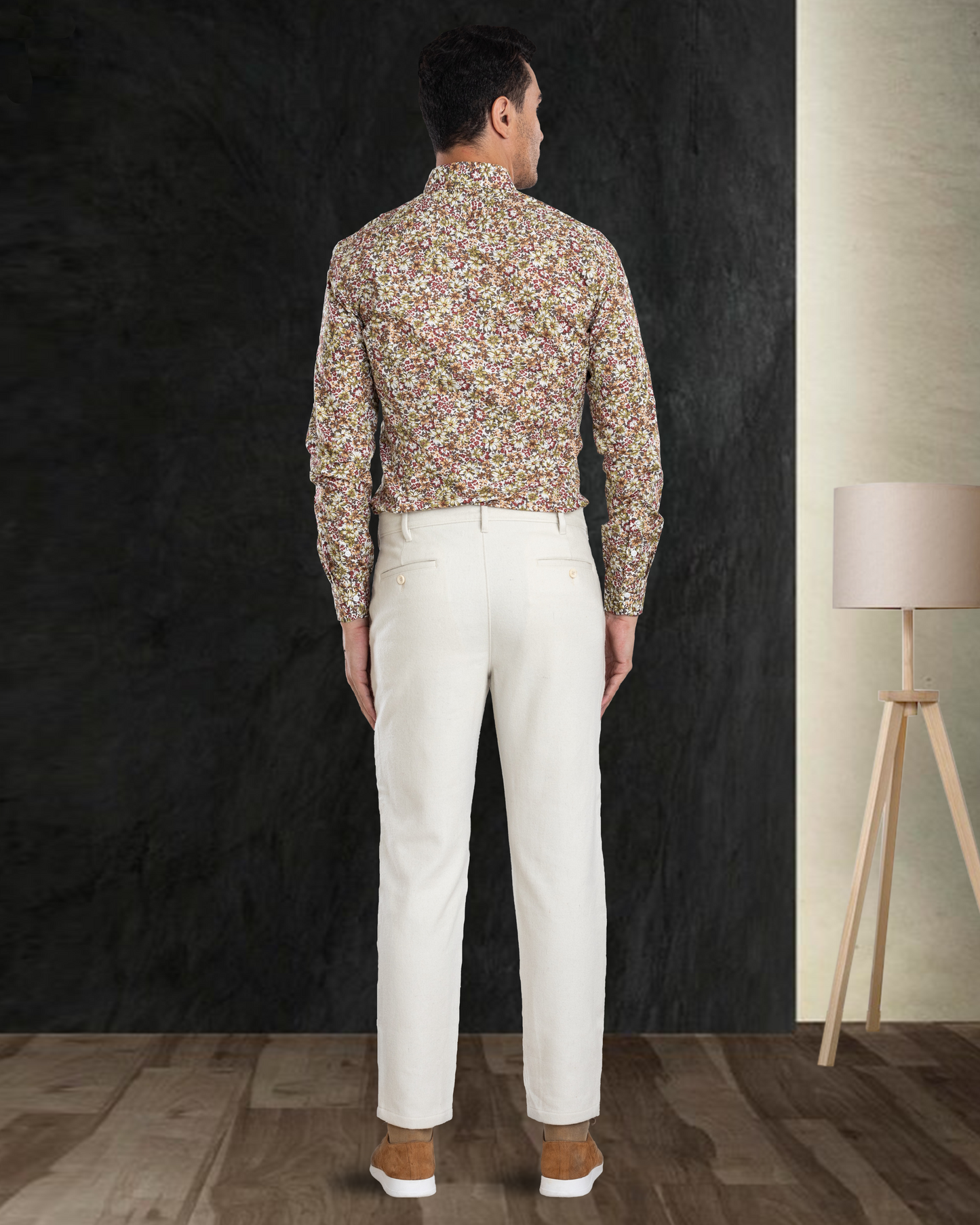 Back view of model wearing custom wool Chino pants for men by Luxire in cream
