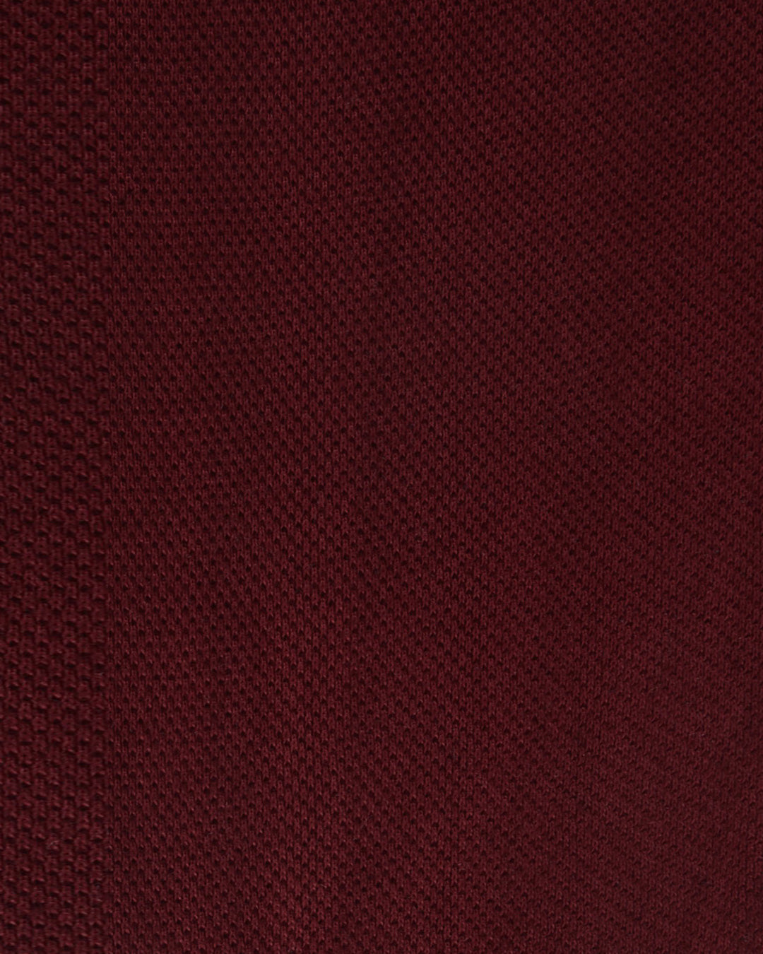 Close up of the custom oxford polo shirt for men by Luxire in maroon