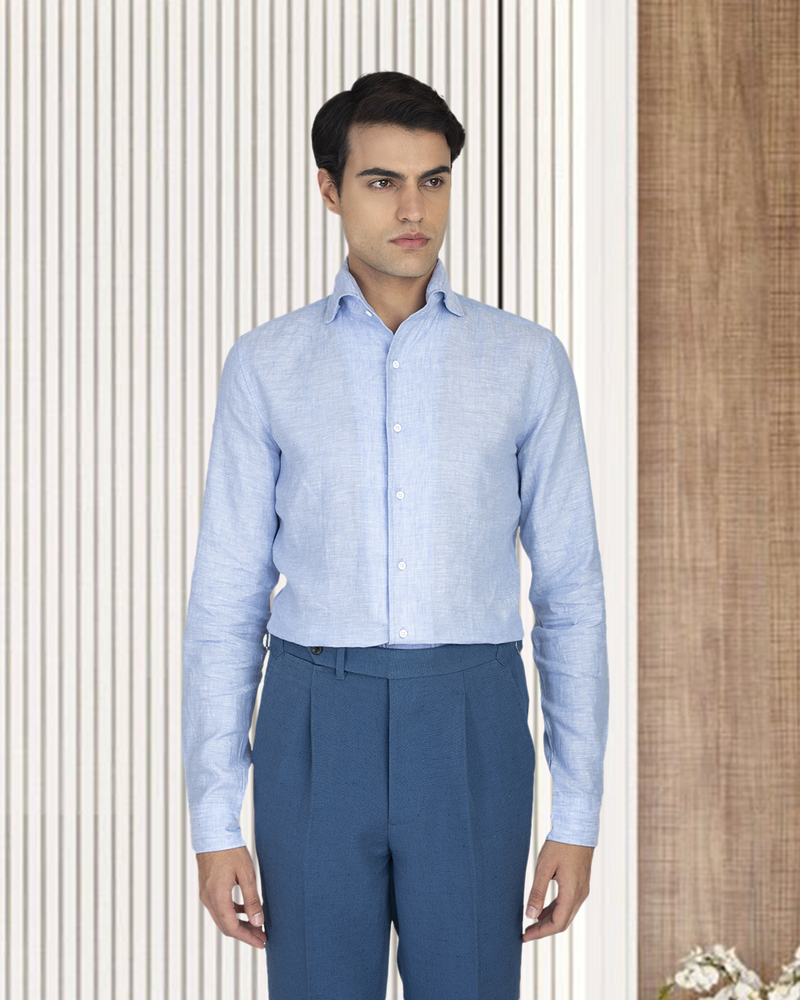 Model wearing the custom linen shirt for men in blue chambray by Luxire Clothing