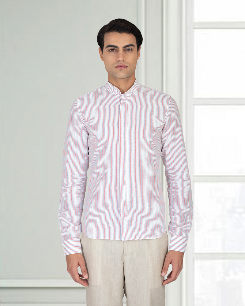 Model wearing the custom linen shirt for men in white with red and blue stripes by Luxire Clothing