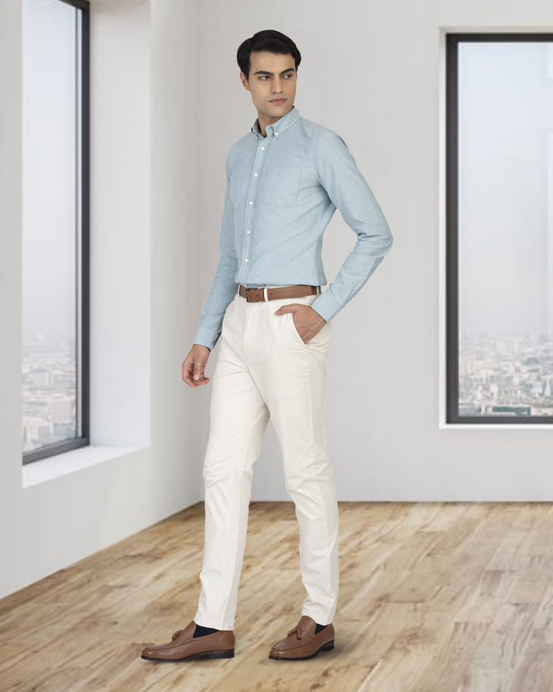 Model wearing custom Genoa Chino pants for men by Luxire in ivory cream hand in pocket