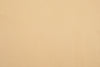 Close up of the custom oxford polo shirt for men by Luxire in light sand