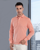 Model wearing the custom oxford polo shirt for men by Luxire in orange white