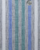 Close up of custom linen shirt for men in green blue and white stripes by Luxire Clothing